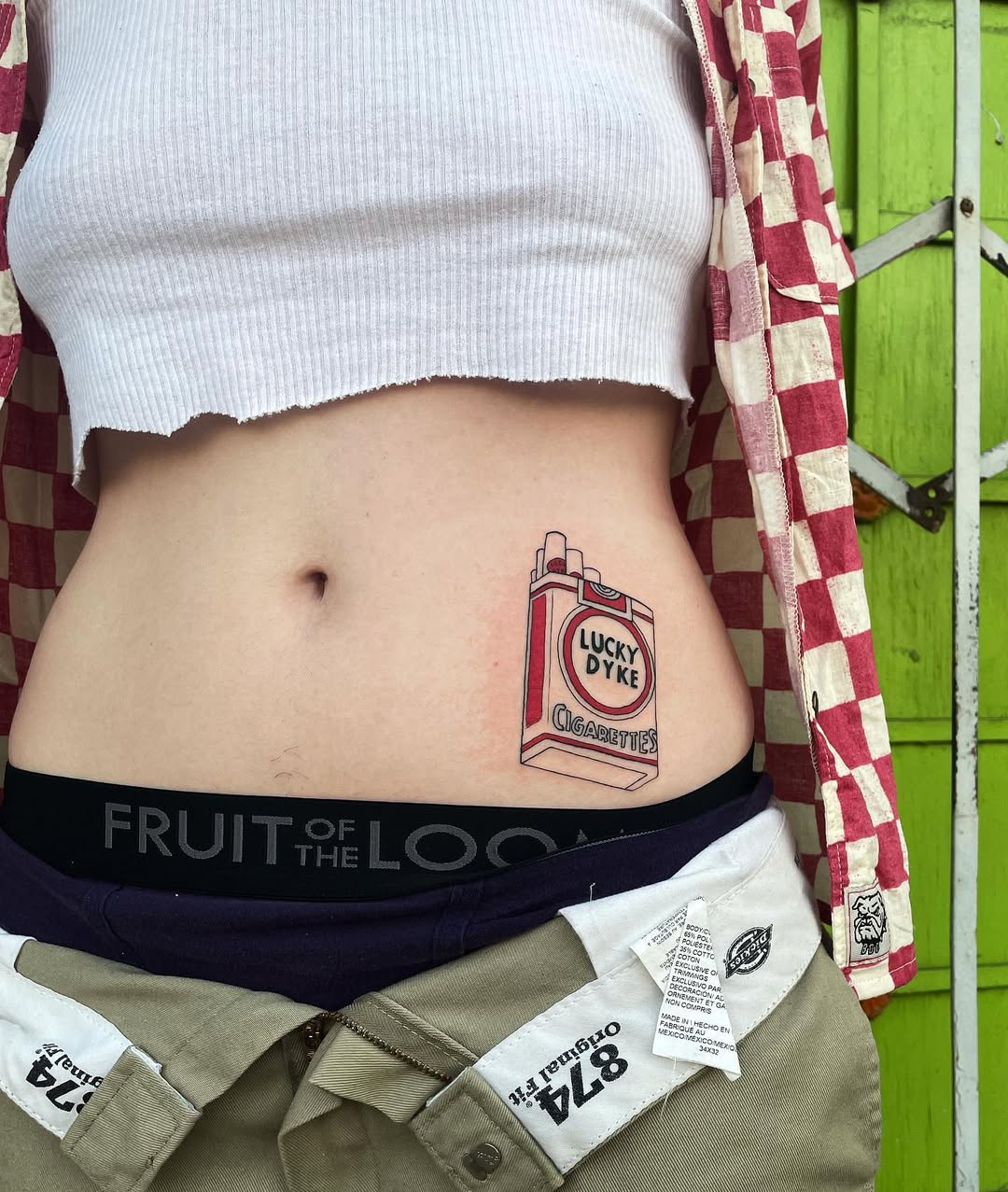 Playful cigarette pack waist tattoo design