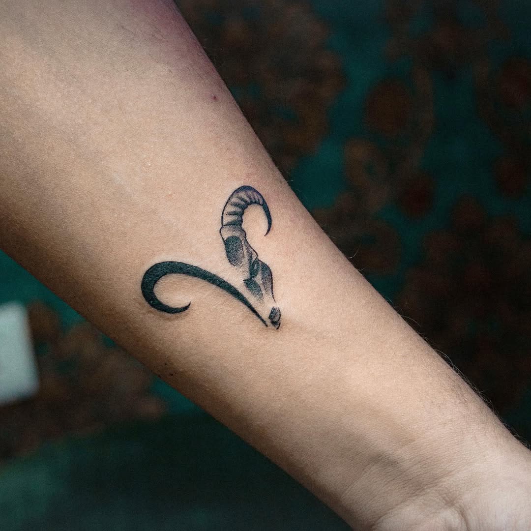 Sleek Capricorn Ram Tattoo on Forearm