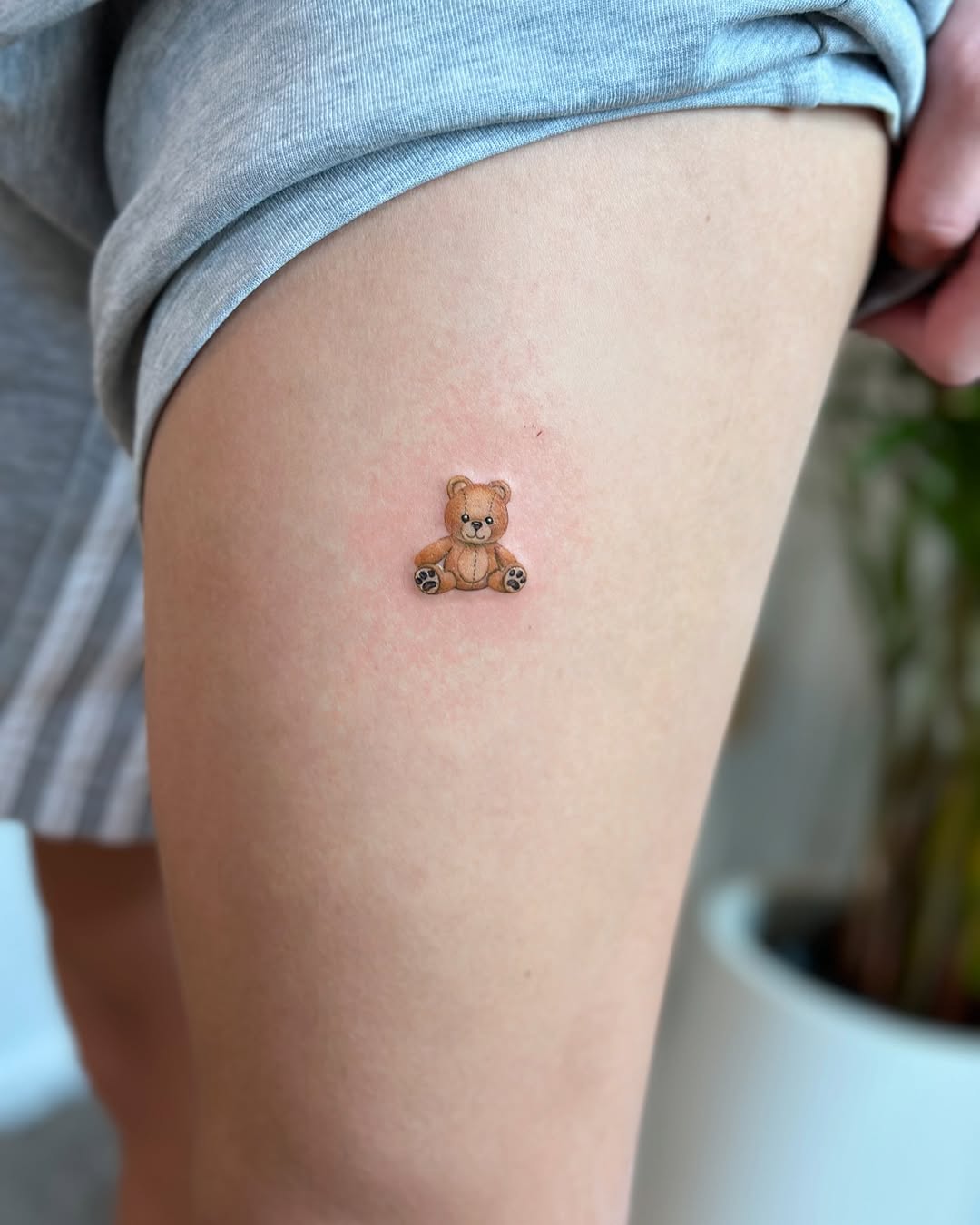 Adorable bear tattoo on thigh