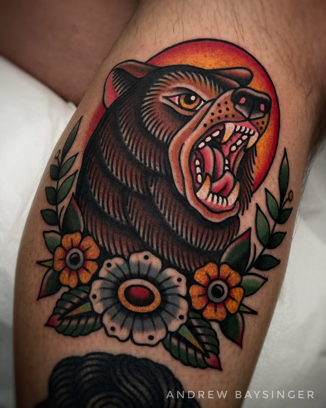 Bold bear tattoo with stunning floral accents