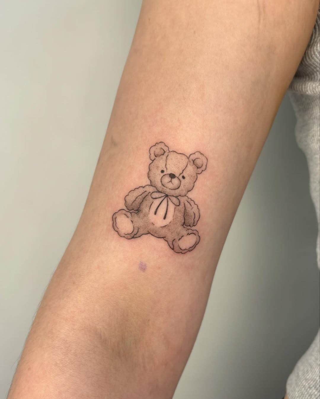Adorable teddy bear tattoo full of charm