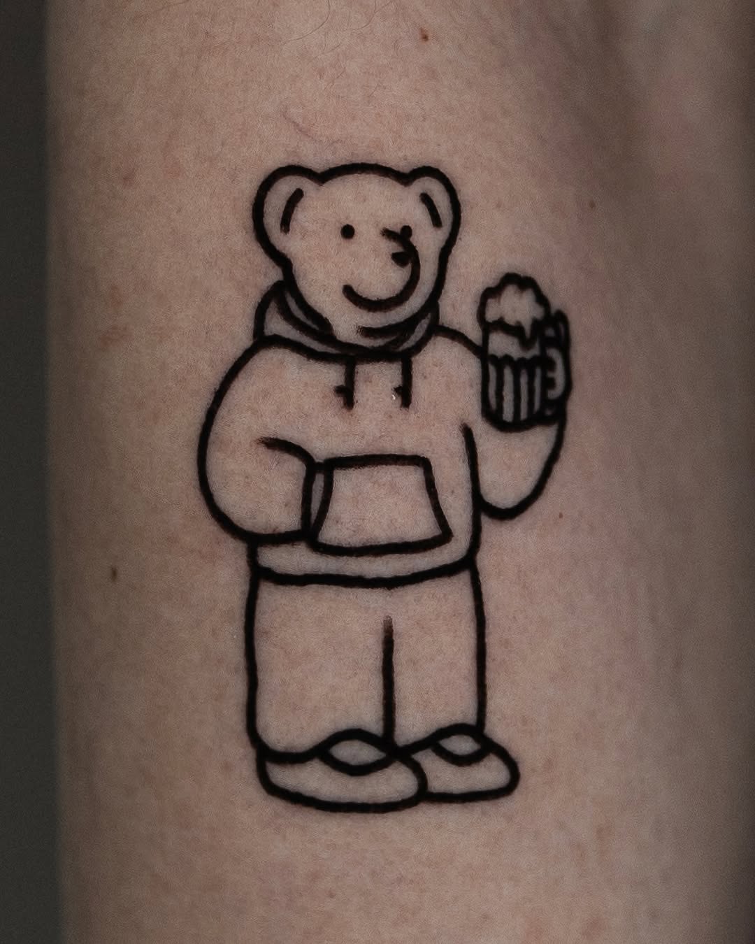 Adorable bear tattoo with a fun vibe