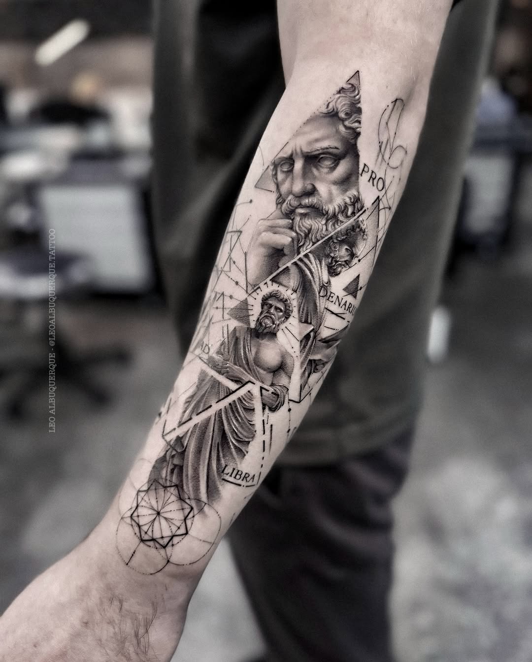 Intricate Black and Gray Forearm Tattoo Design