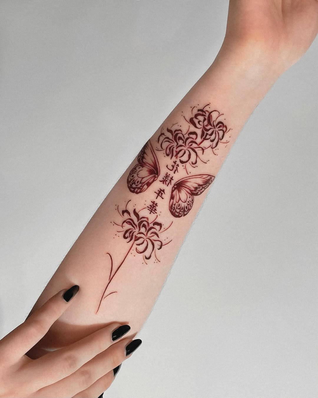 Stunning Red Ink Butterfly and Floral Tattoo