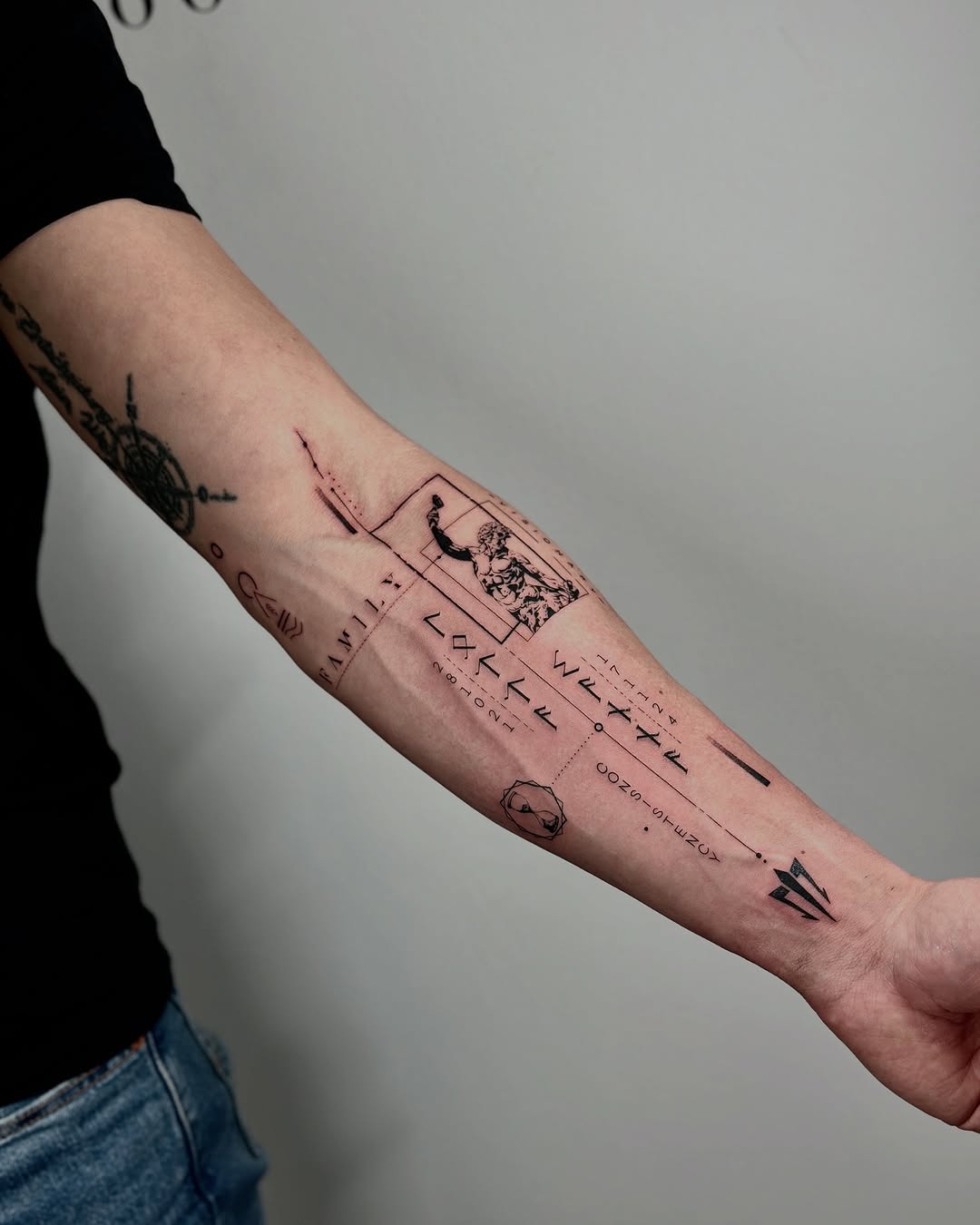 Artistic minimalist tattoo design on forearm