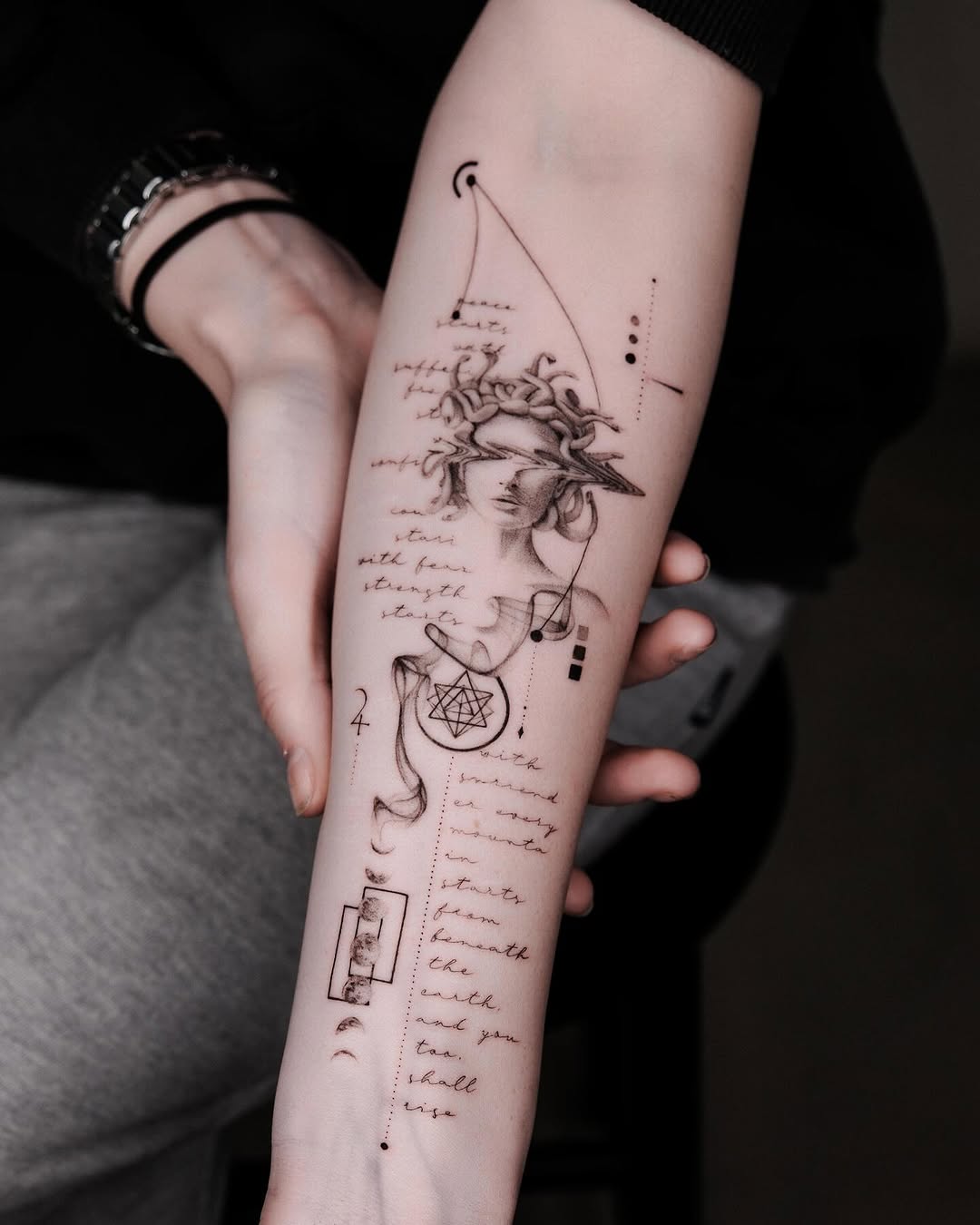 Elegant black ink forearm tattoo design