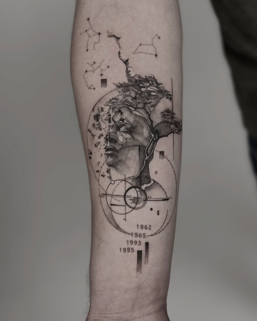 Conceptual forearm tattoo blending nature and identity