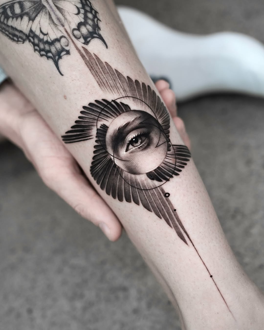 Intricate Eye Tattoo with Feather Design