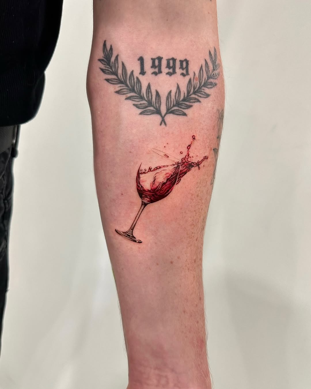 Artful representation of a wine glass tattoo