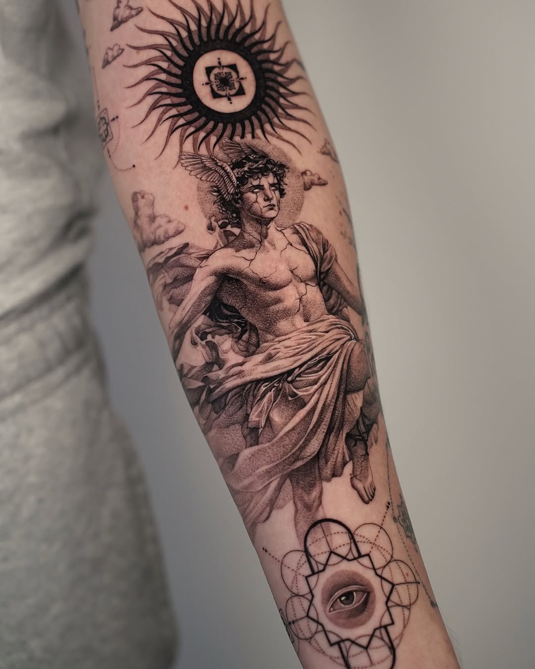 Classical Greek art-inspired forearm tattoo detail