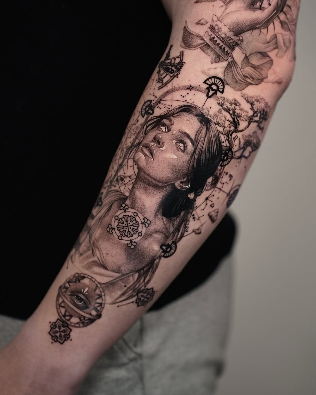 Intricate forearm tattoo showcasing a serene portrait