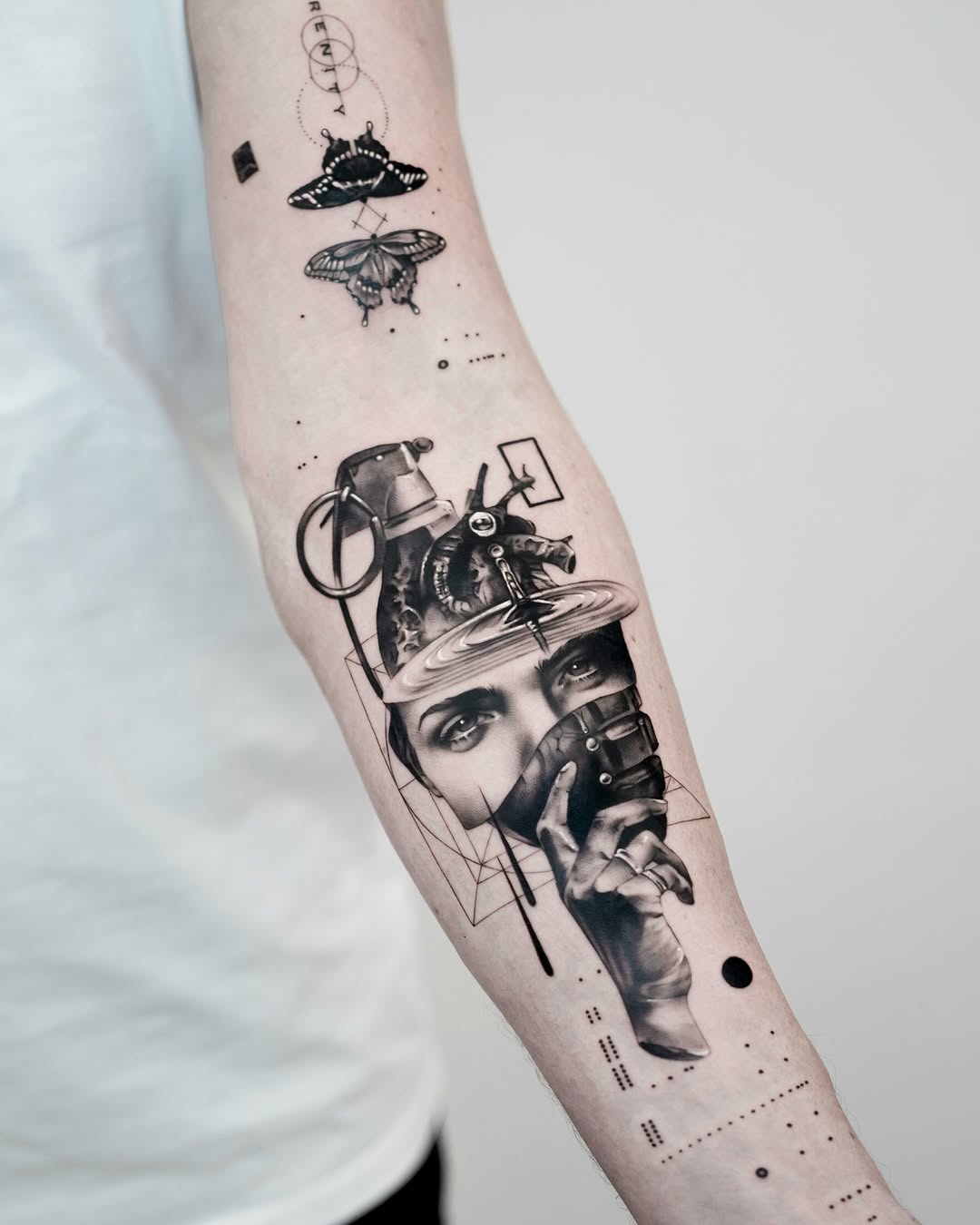 Unique artistic forearm tattoo with surreal elements