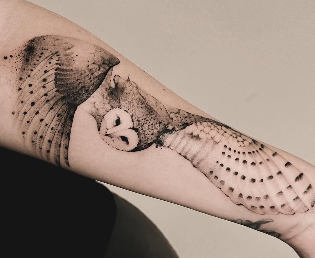 Intricate owl tattoo with detailed feather patterns