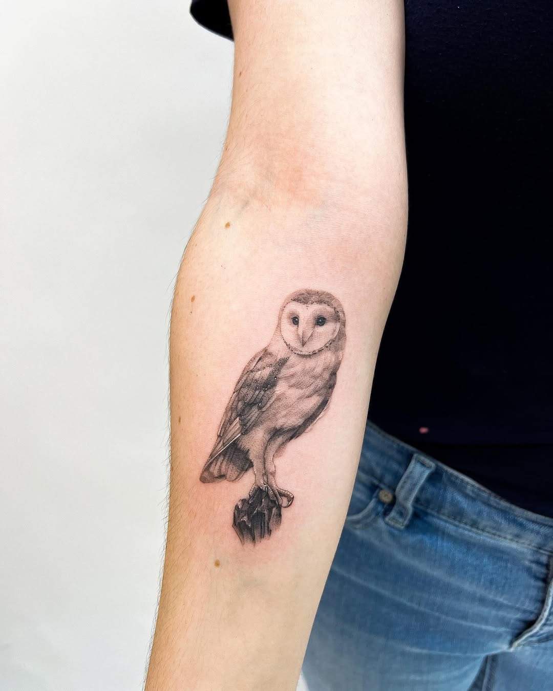 Elegant owl tattoo with detailed artistry