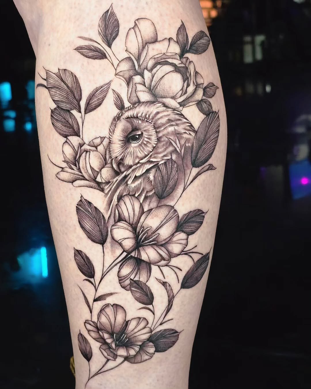 Elegant owl surrounded by delicate floral patterns