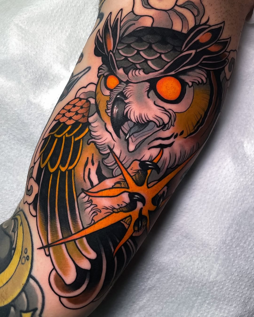 Artistic owl tattoo with vibrant colors