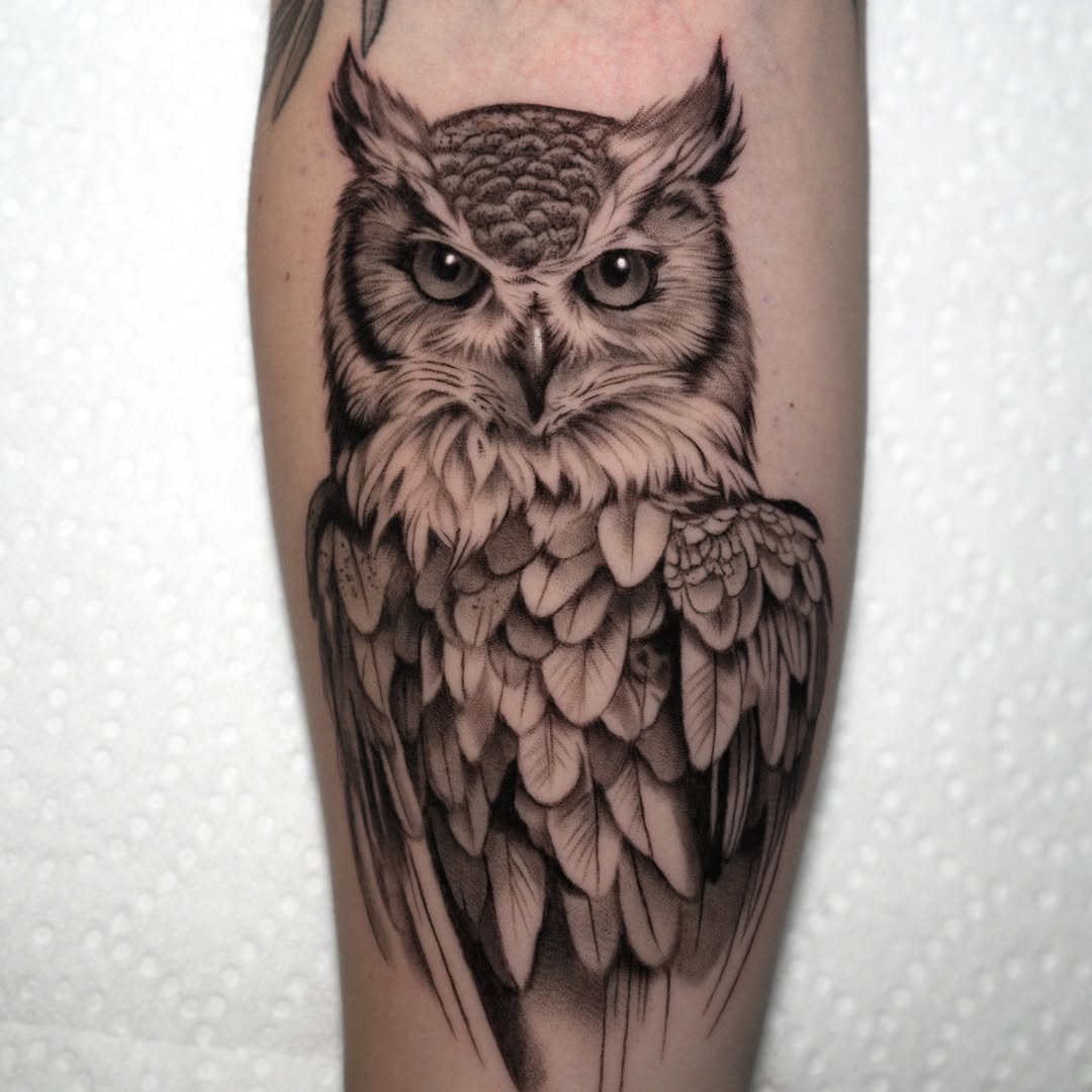 Elegant black and grey owl tattoo design