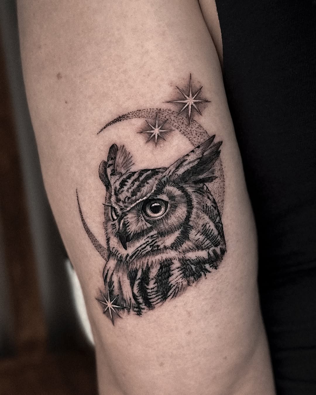 Mystical owl tattoo with celestial elements