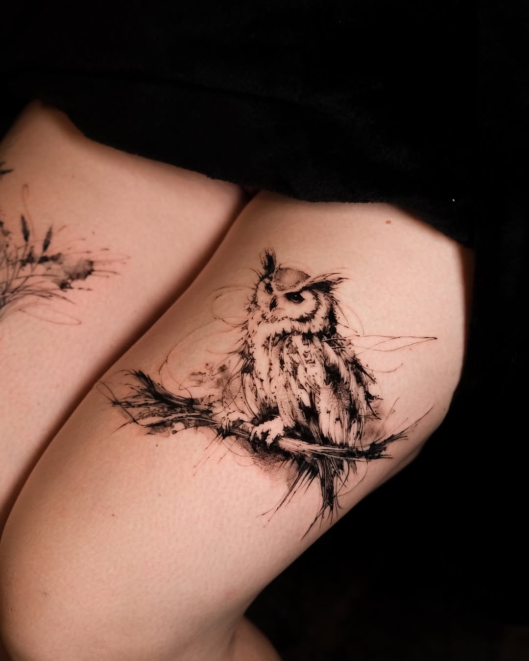 Whimsical owl perched on a branch tattoo