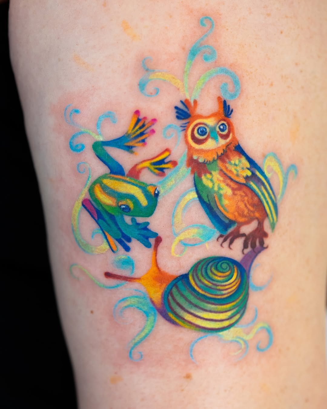 Vibrant owl tattoo with whimsical elements