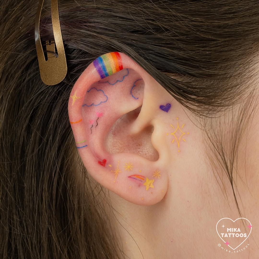 Vibrant ear tattoos with playful motifs