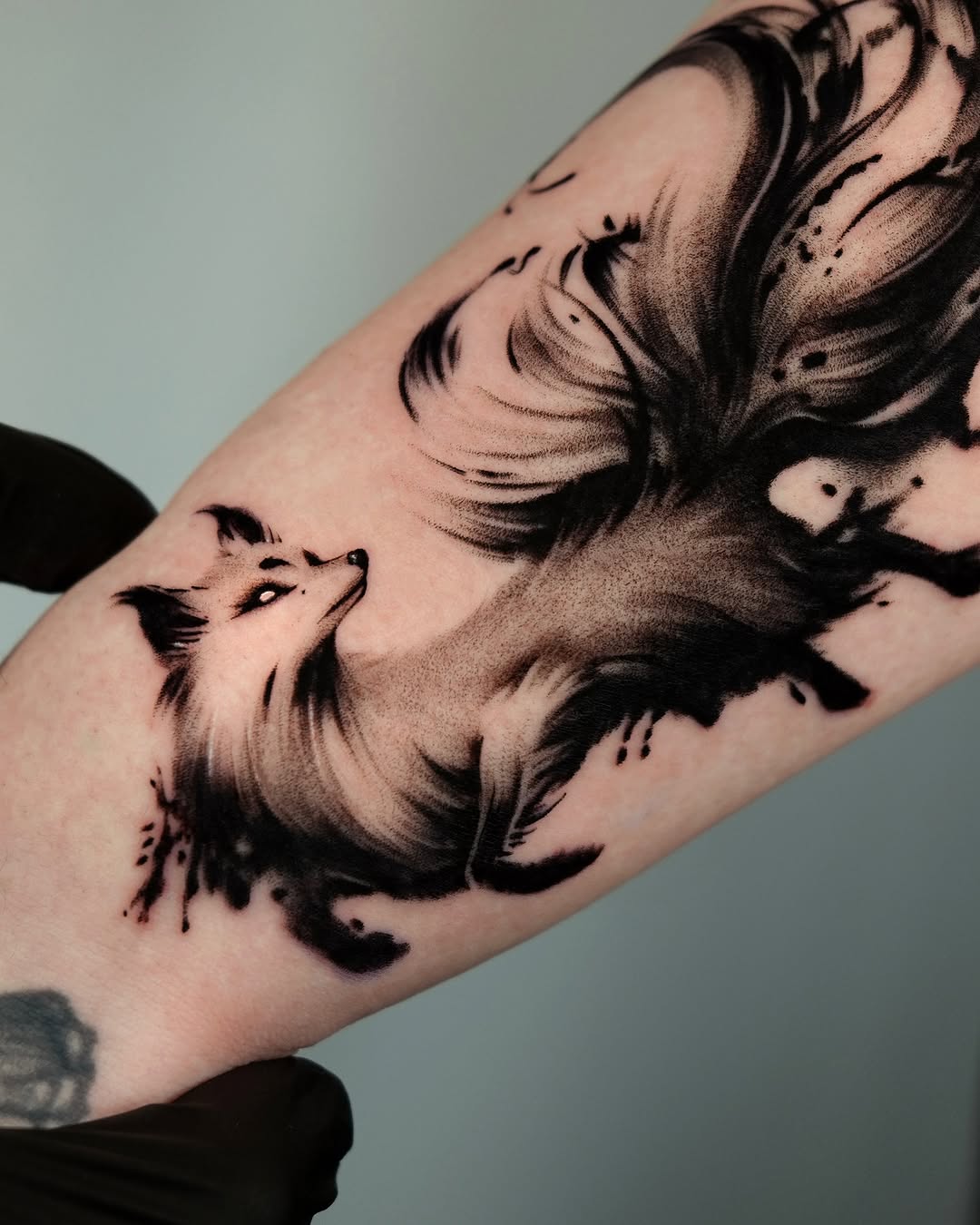 Artistic fox tattoo in watercolor style