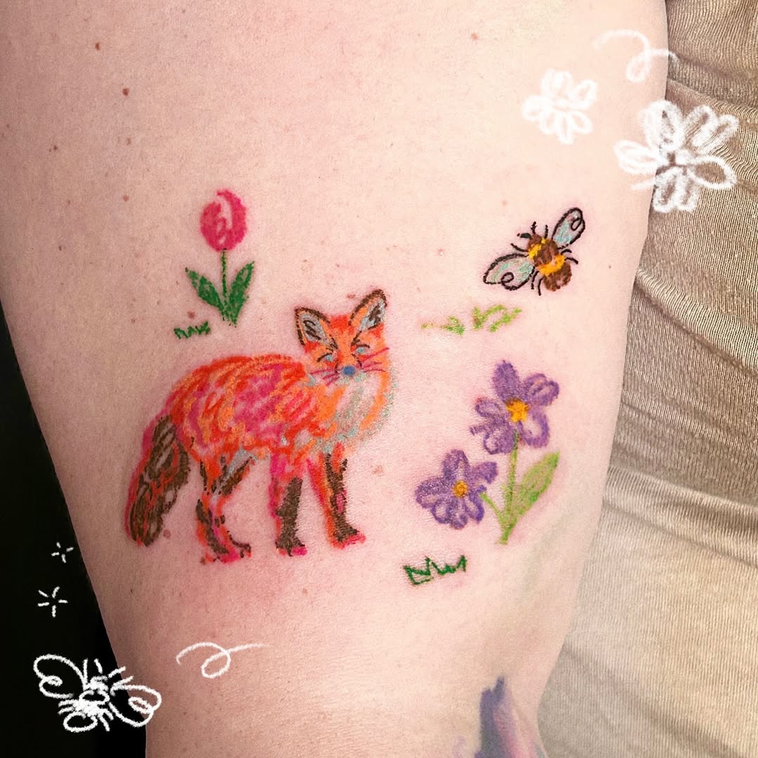 Vibrant fox tattoo surrounded by nature elements