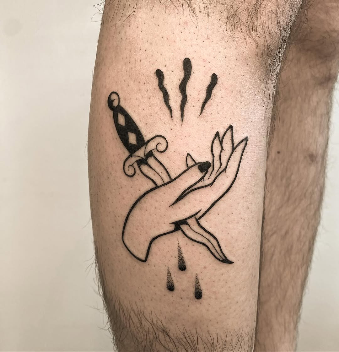 An edgy dagger tattoo with classic vibes