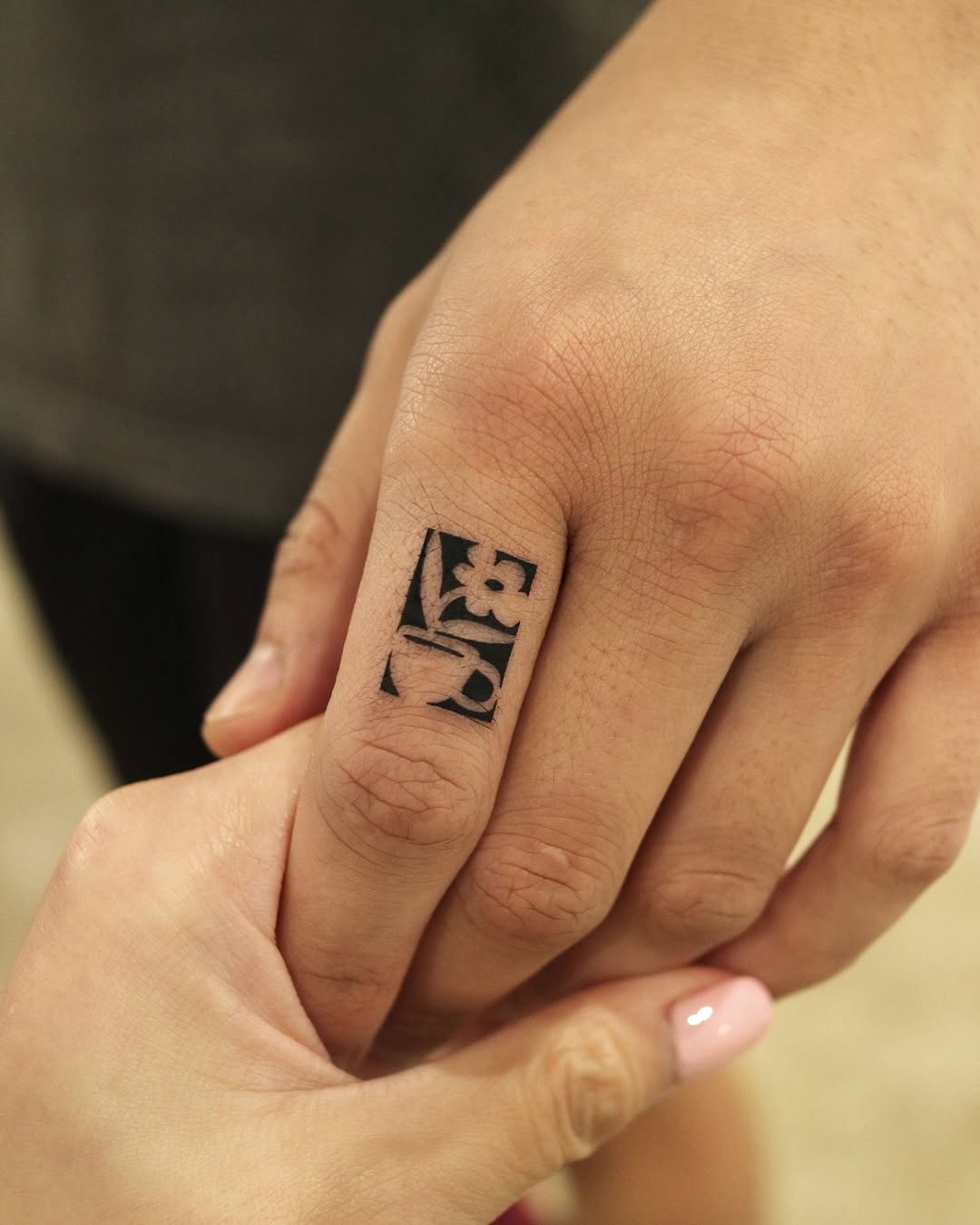 Sleek Minimal Line Ink Tattoo on Finger