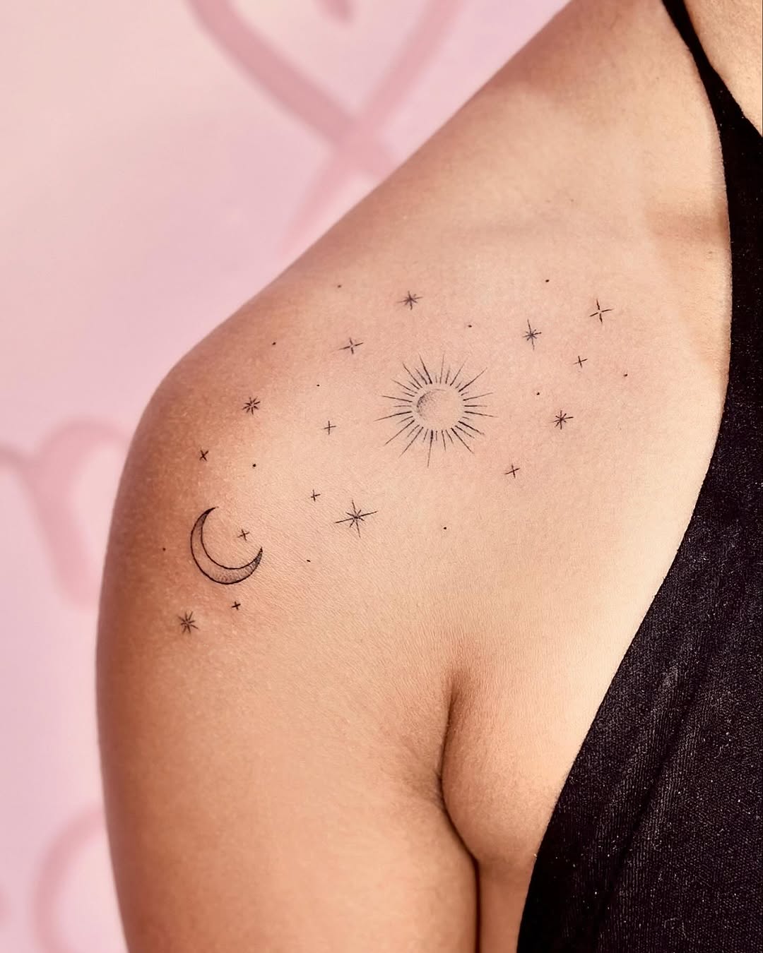 Celestial minimalist tattoo with sun and moon