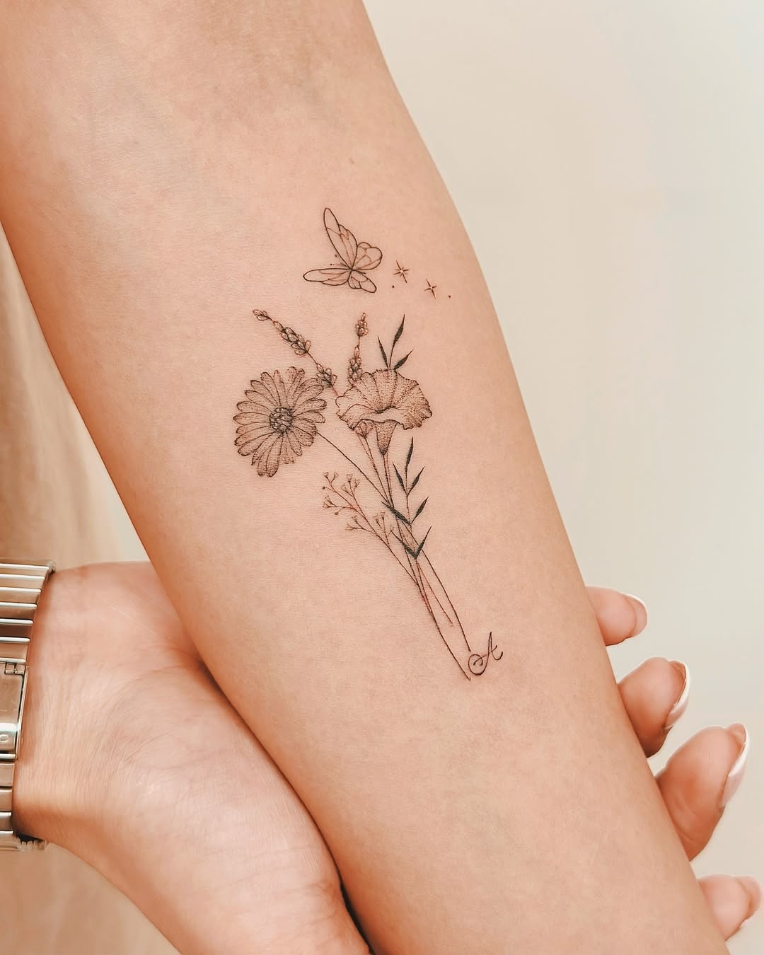 Delicate floral and butterfly minimalist tattoo design