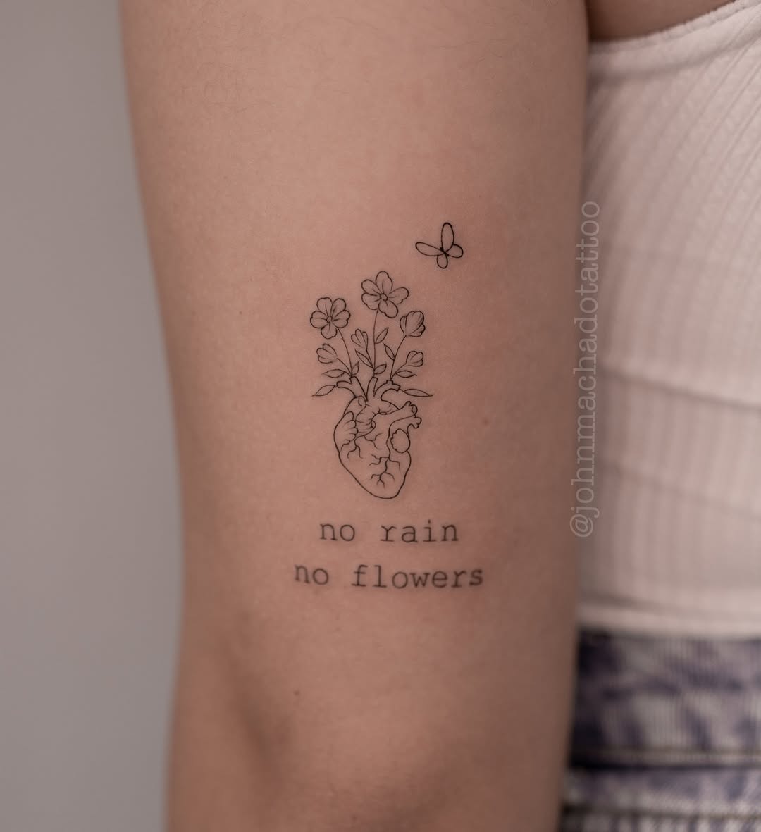 Heart and flowers tattoo with profound message