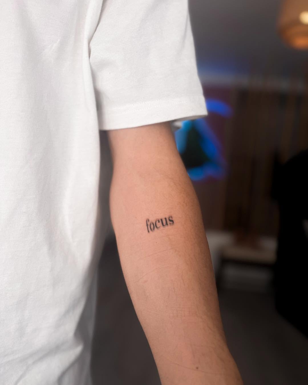 Simple yet powerful word tattoo on arm