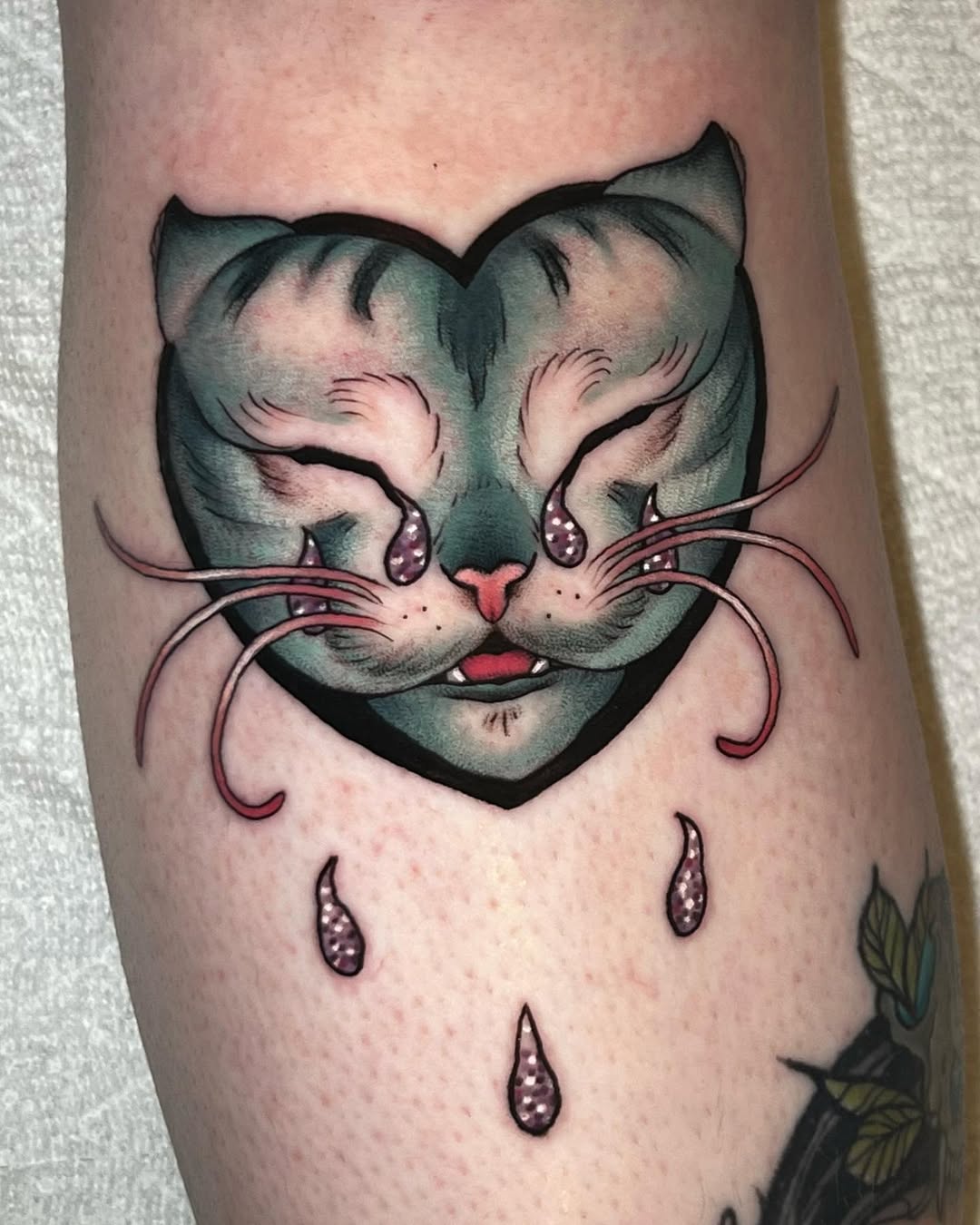 Unique heart-shaped cat tattoo design in color