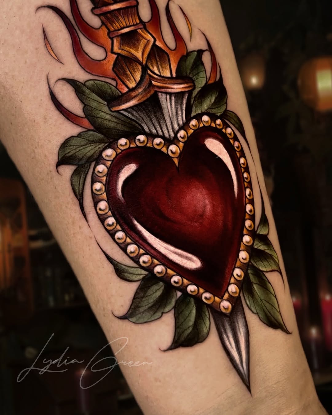 Exquisite heart tattoo with dagger and flames