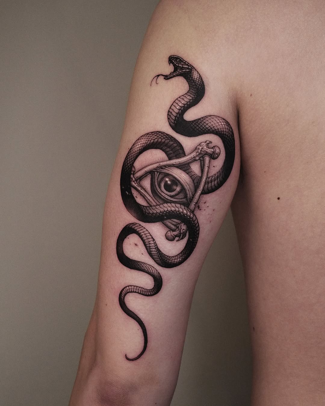 Mysterious Snake Tattoo with an Eye Design