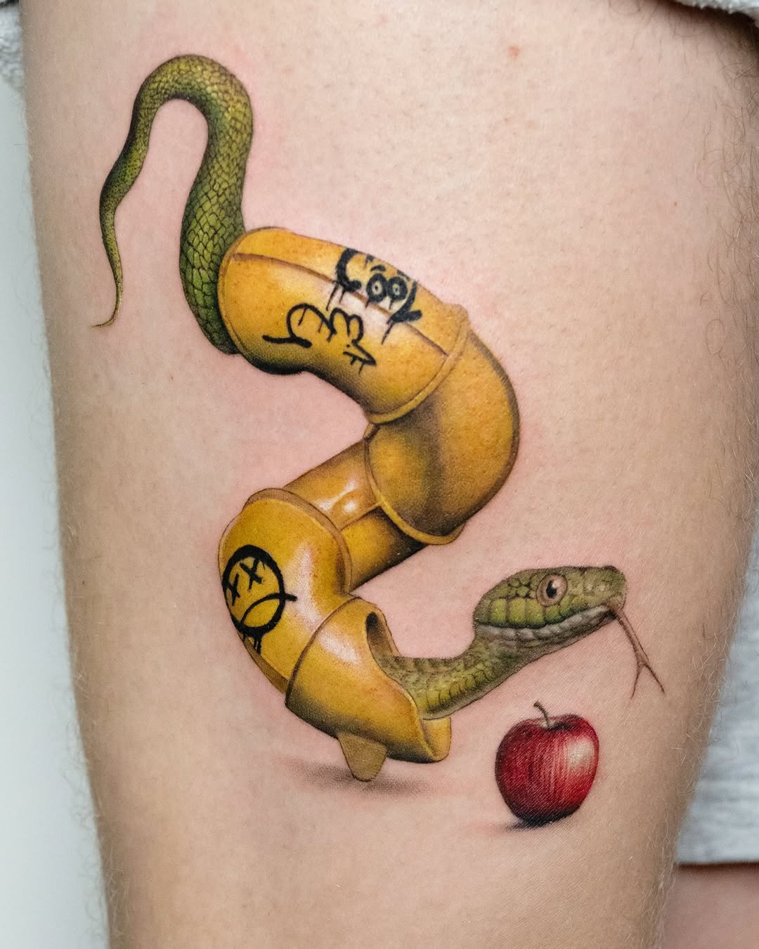 Whimsical snake tattoo with playful elements