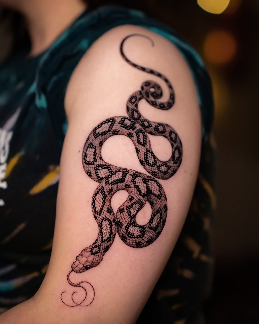 Detailed snake tattoo with intricate scales