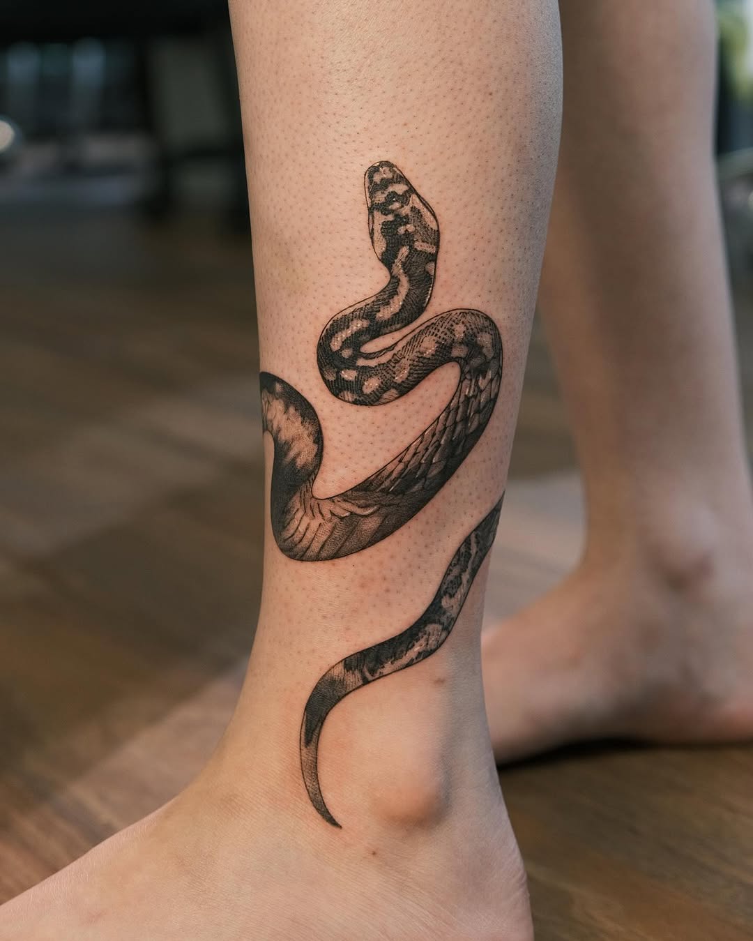 Elegant snake tattoo showcasing intricate detailing