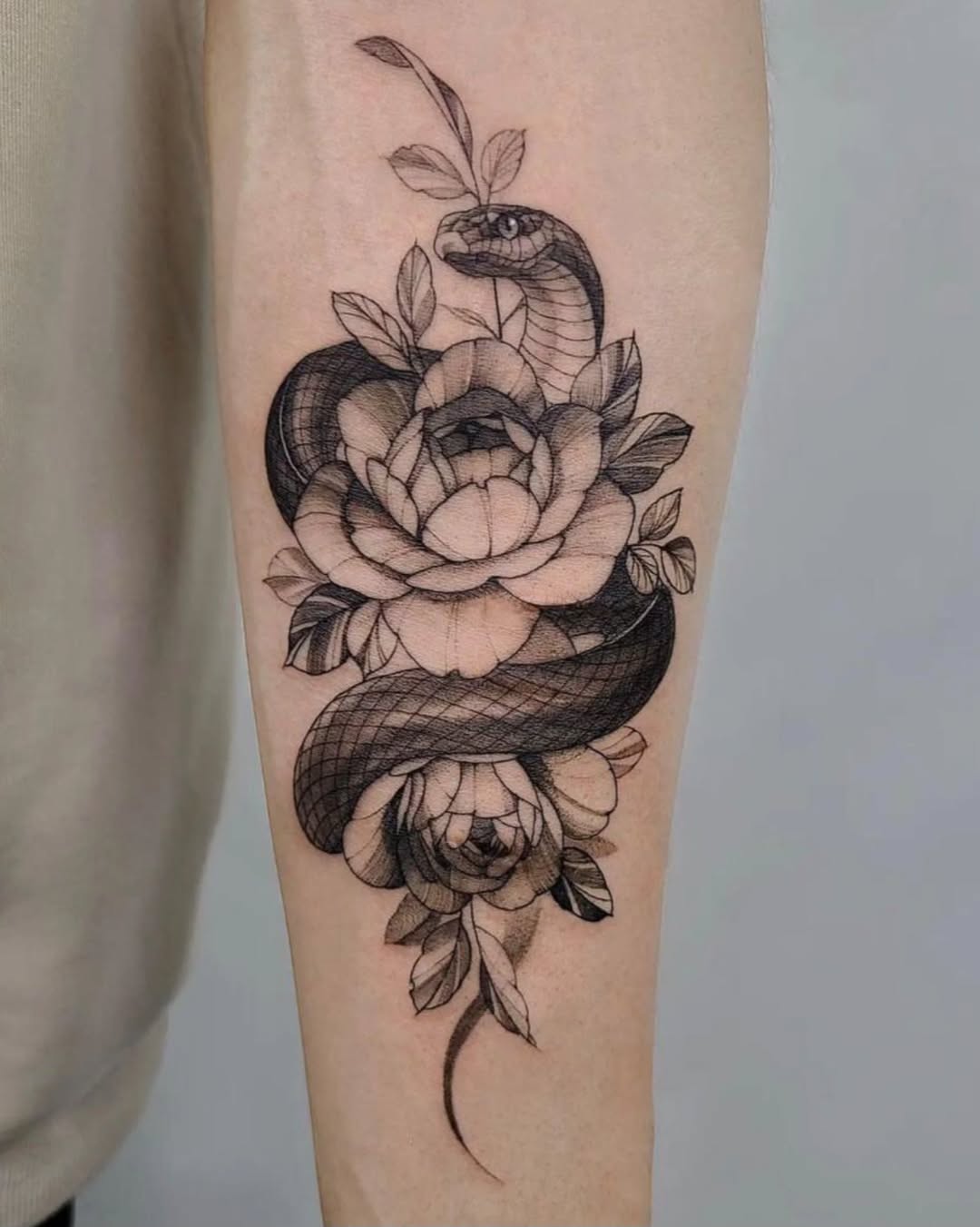Elegant snake entwined with vibrant flowers