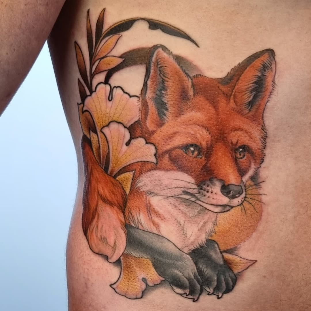 Stunning Fox Rib Tattoo with Floral Elements