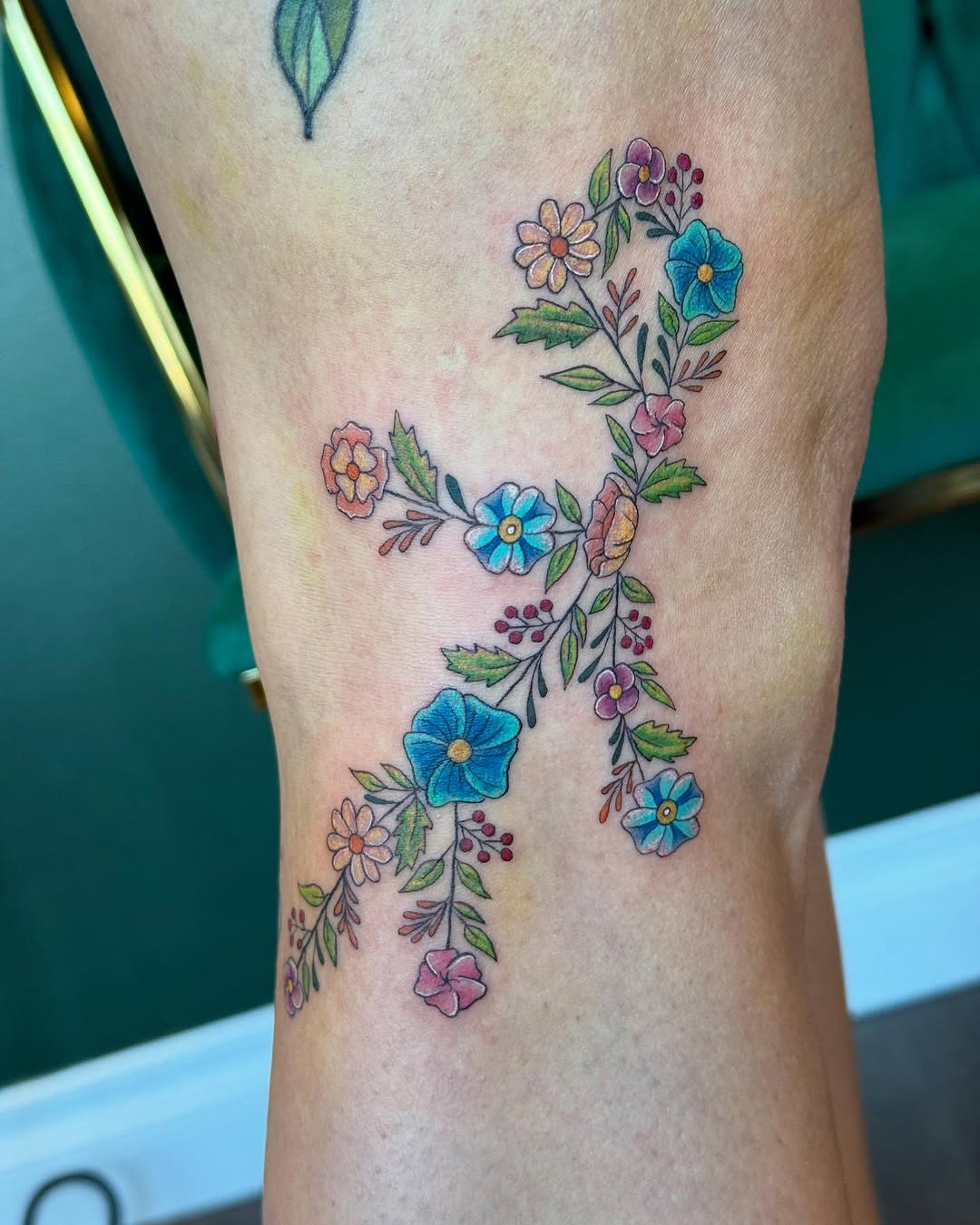 Floral Virgo Tattoo with Colorful Accents