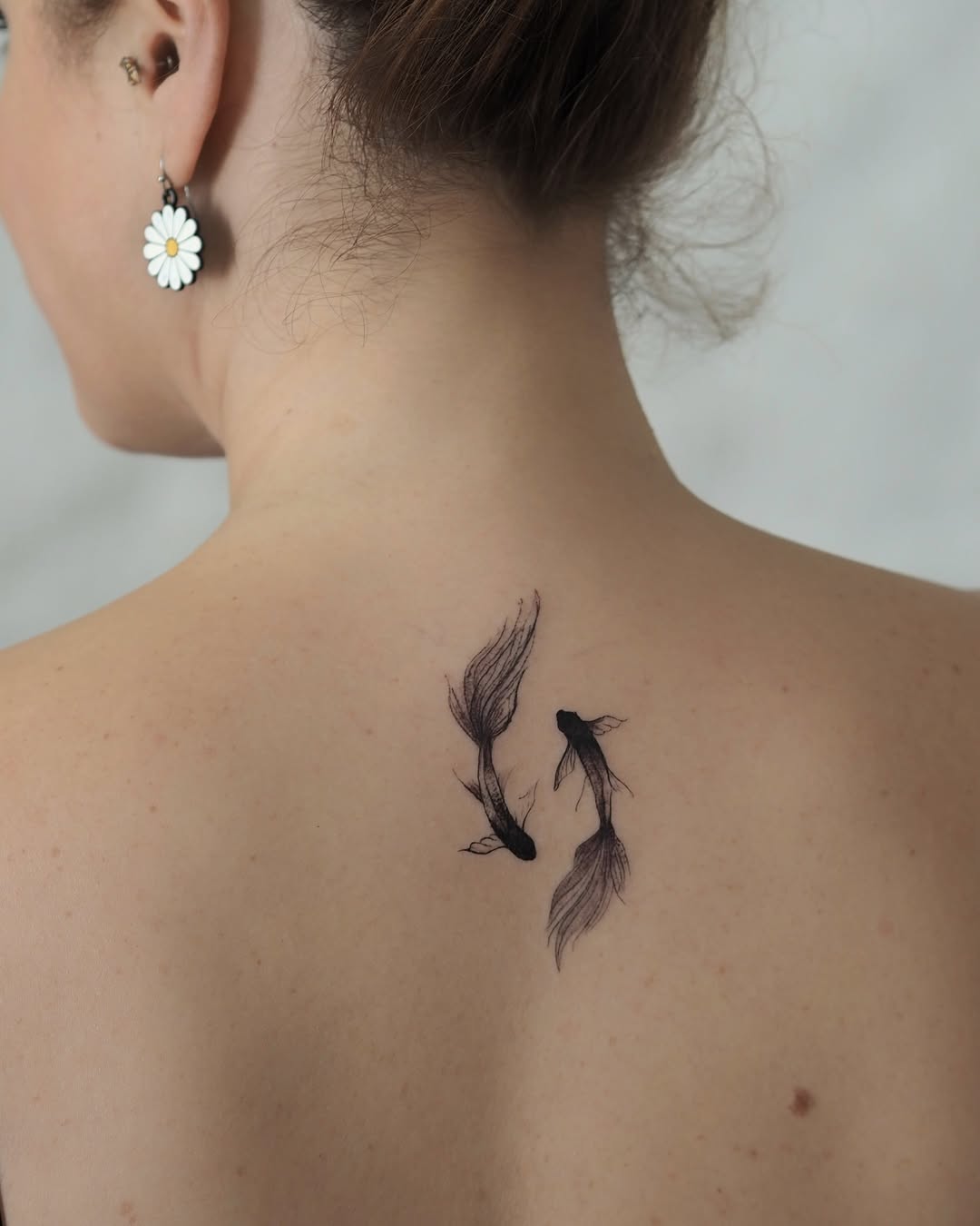 Elegant koi fish tattoo on the back