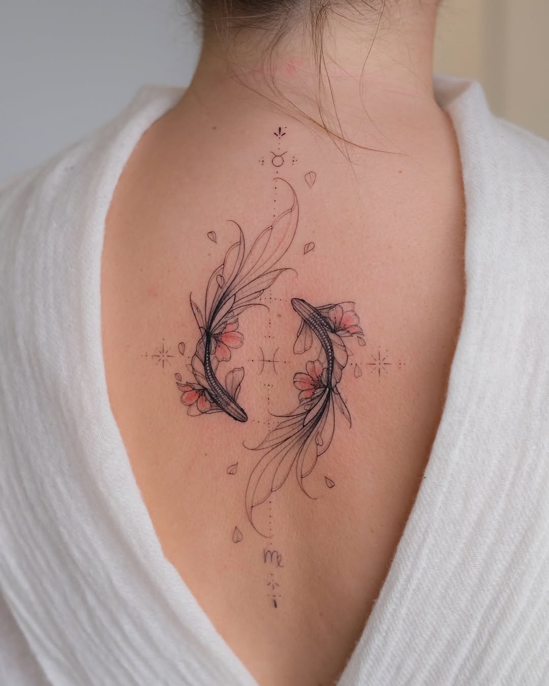 Elegant koi fish tattoo with floral elements