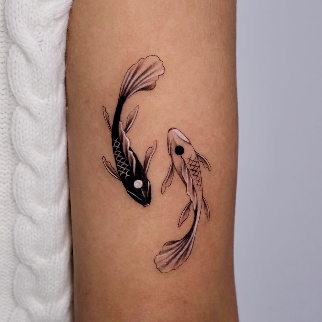 Elegant black and white koi fish tattoos