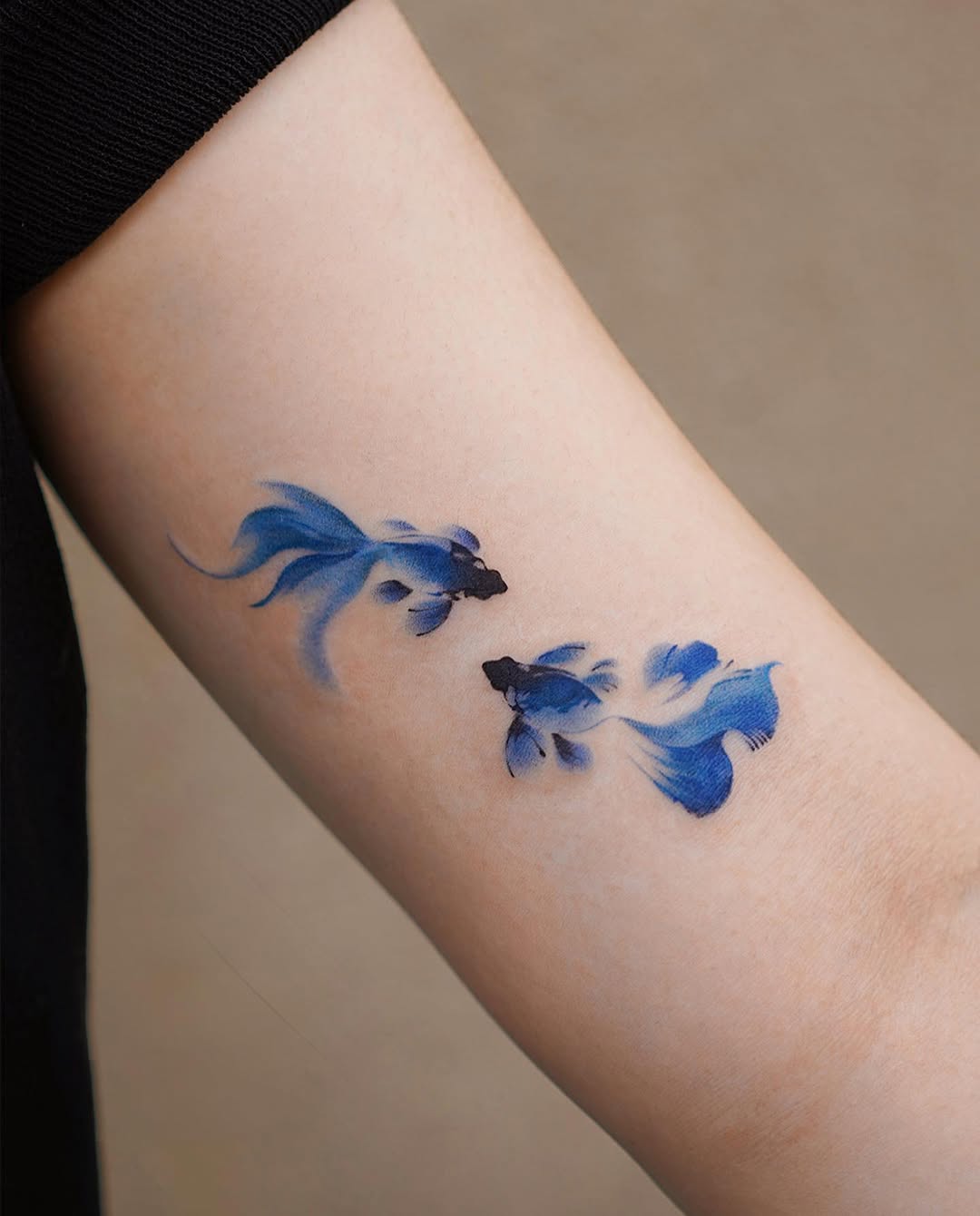 Elegant blue koi fish tattoo design