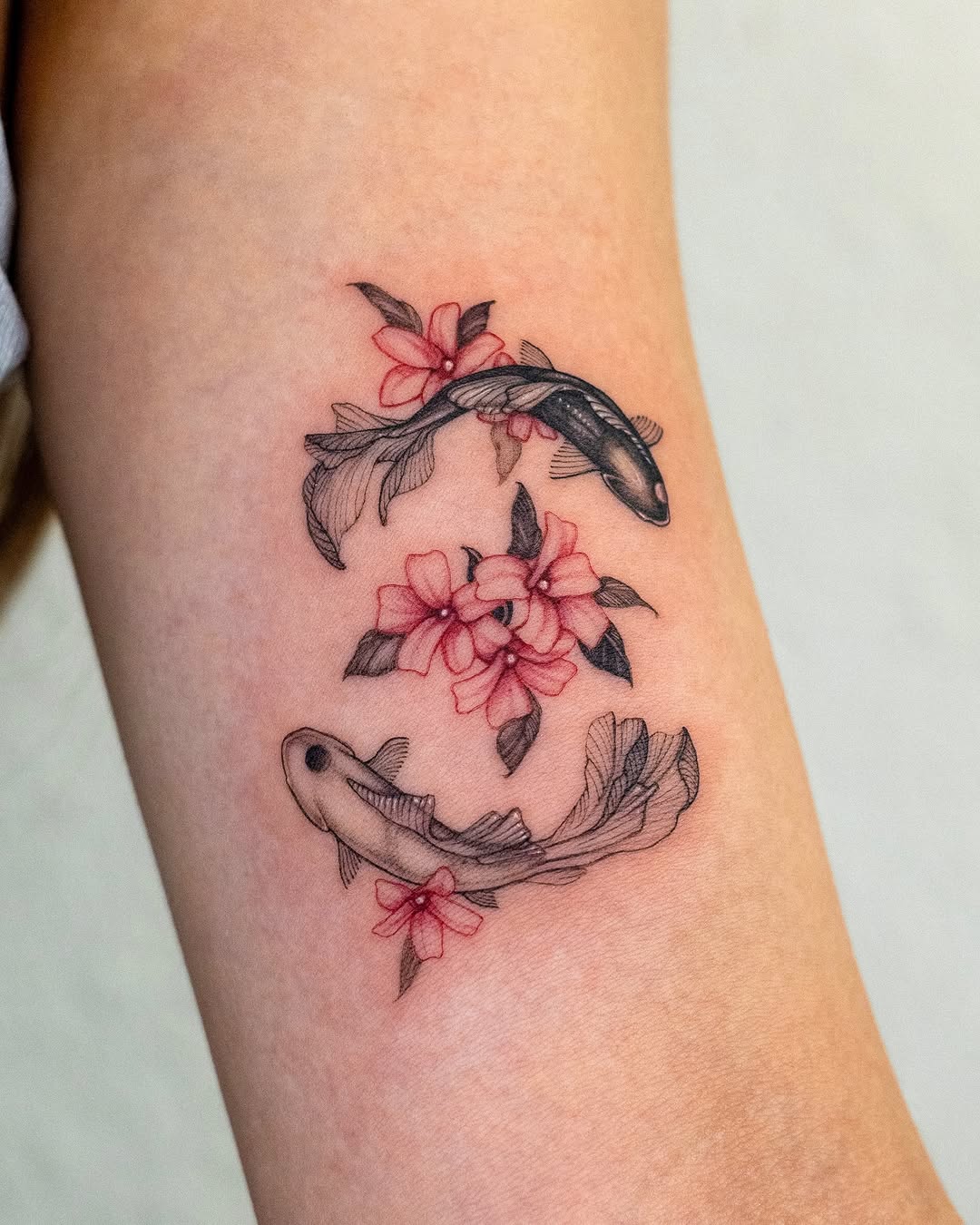 Elegant koi fish entwined with blooming flowers