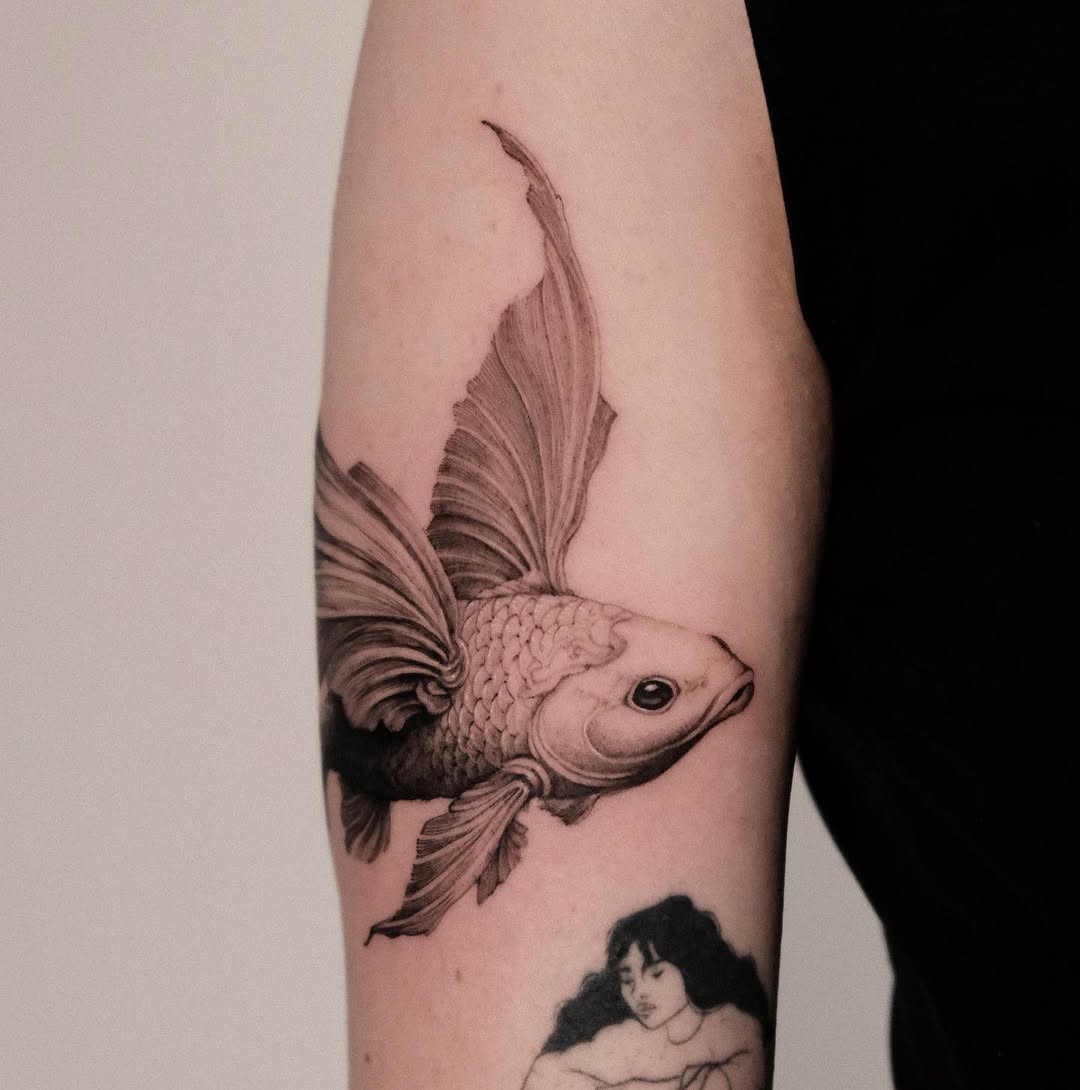 Elegant black and white koi fish tattoo design