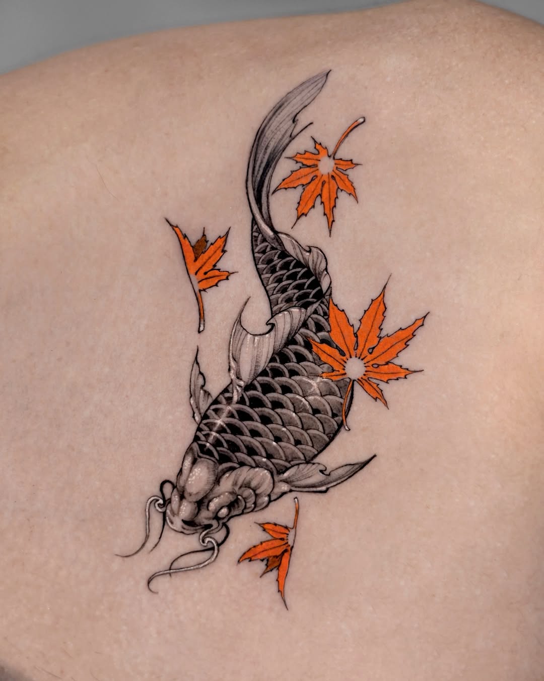 Elegant koi fish tattoo with autumn leaves