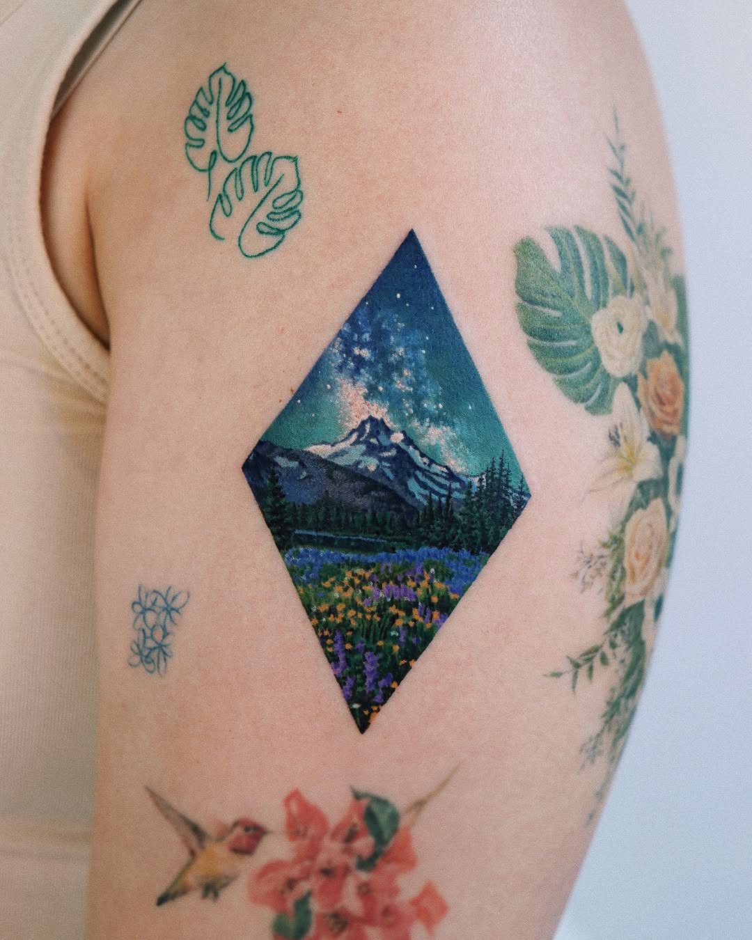 Stunning mountain scene captured in vibrant ink.